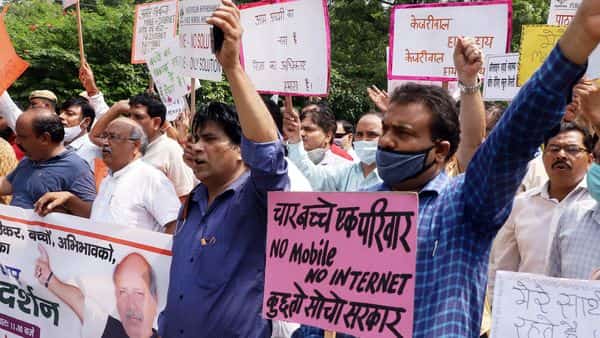 Parents and teachers staged a protest outside Delhi Chief Minister Arvind Kejriwal