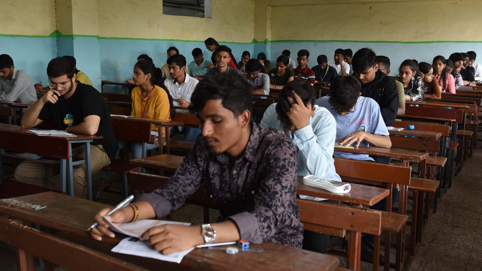 Haryana boards: People climb walls of Tauru exam centre to help students cheat